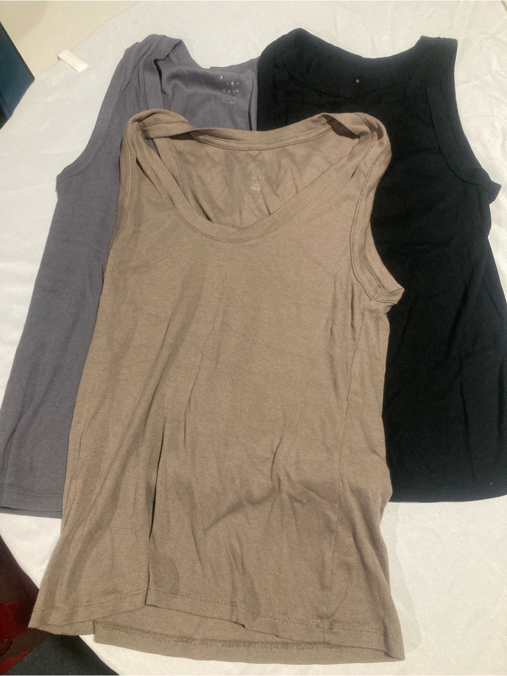 3 A New Day tank tops